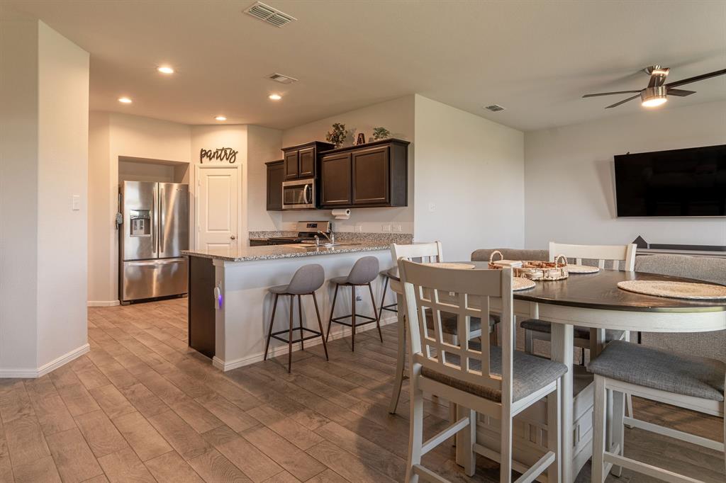 9712 Cherryville Road Fort Worth, TX 76108 - Photo 15 of 27 a view of a dining room with furniture