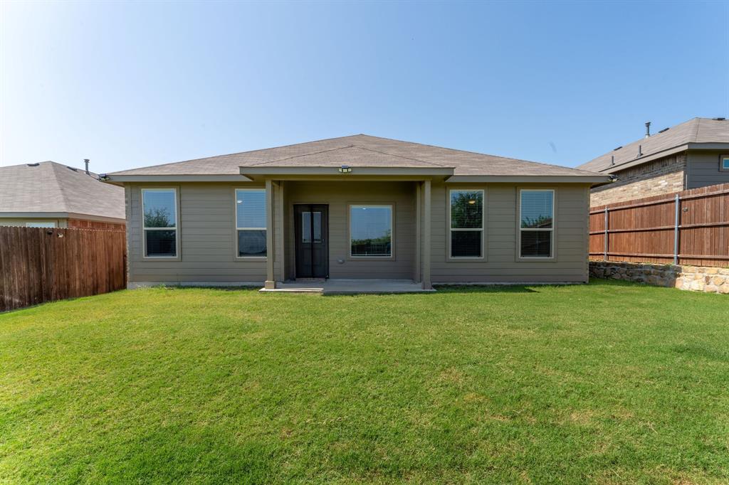 9712 Cherryville Road Fort Worth, TX 76108 - Photo 20 of 27 a view of a house with backyard