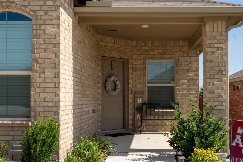 9712 Cherryville Road Fort Worth, TX 76108 - Photo 2 of 27 a view of a entryway door front of house