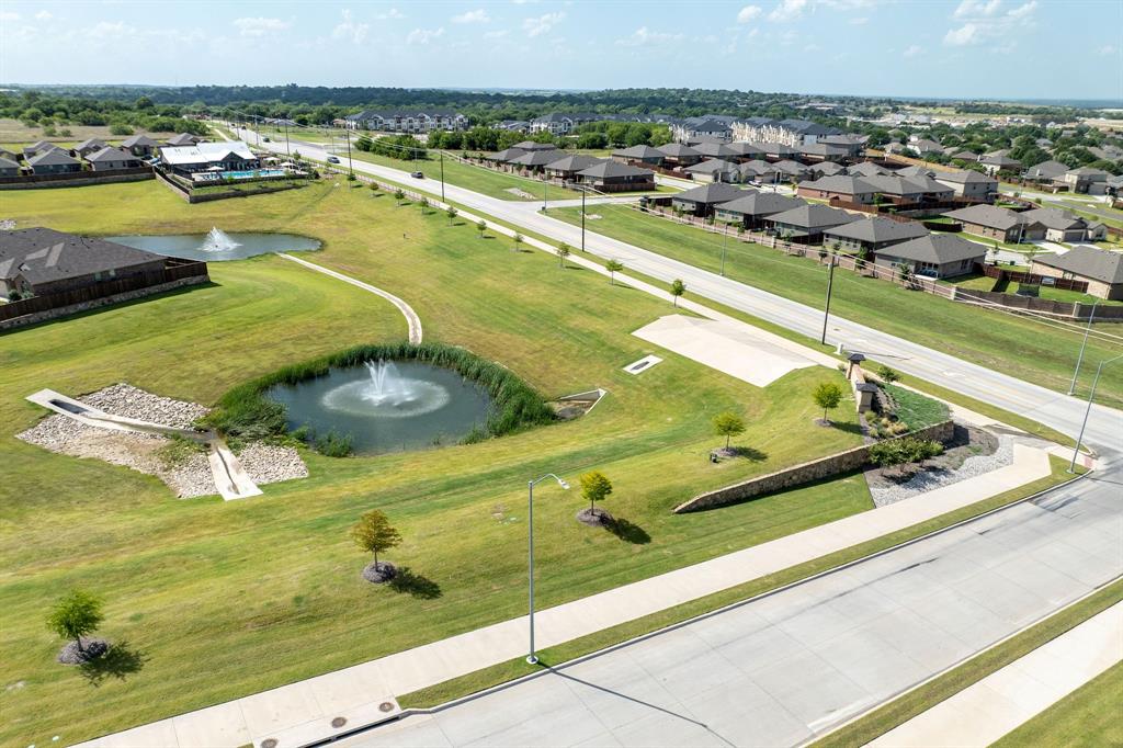 9712 Cherryville Road Fort Worth, TX 76108 - Photo 24 of 27 a view of a swimming pool with outdoor seating
