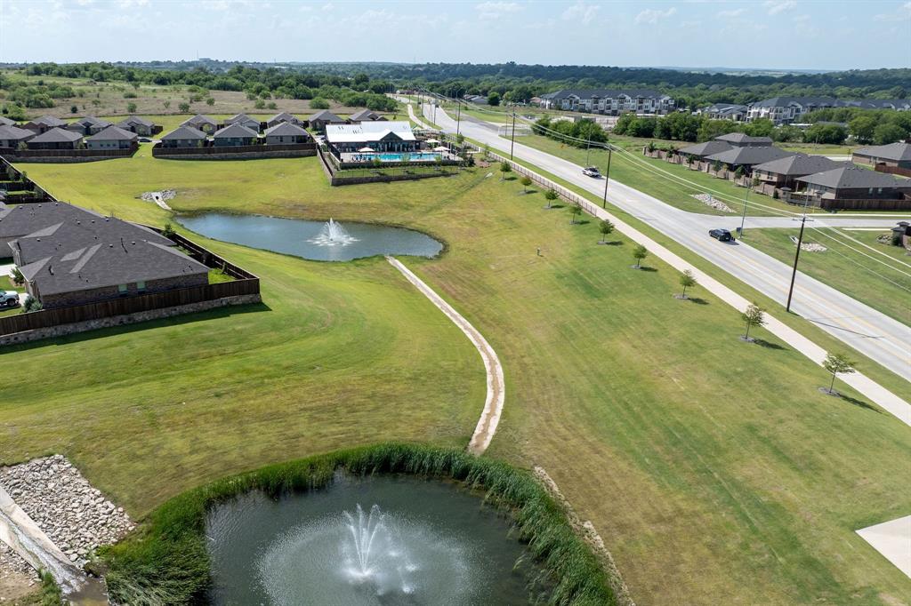9712 Cherryville Road Fort Worth, TX 76108 - Photo 25 of 27 a view of a swimming pool with a lake