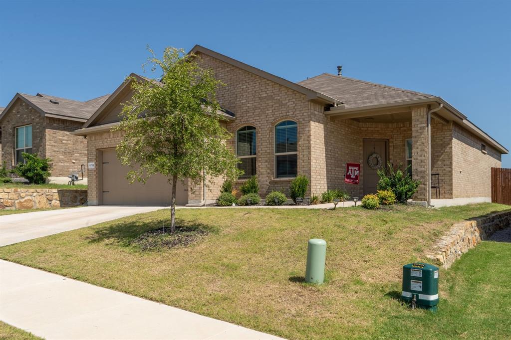 9712 Cherryville Road Fort Worth, TX 76108 - Photo 4 of 27 front view of a house with a yard