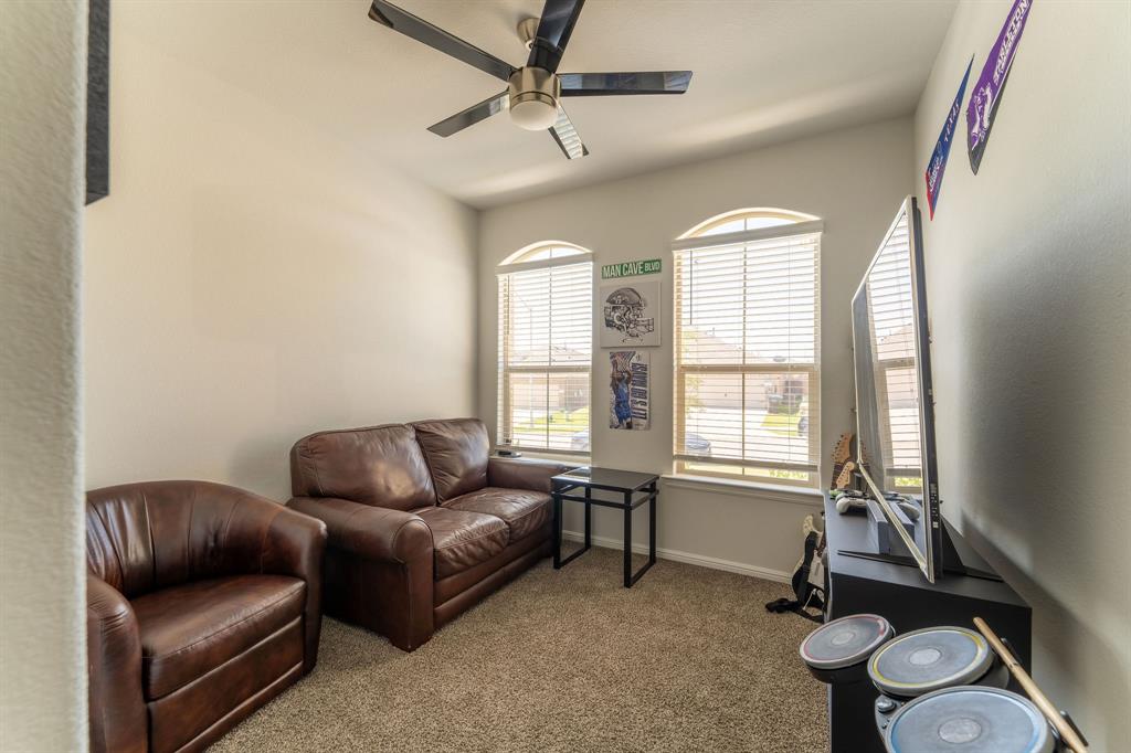 9712 Cherryville Road Fort Worth, TX 76108 - Photo 5 of 27 a living room with furniture and a window