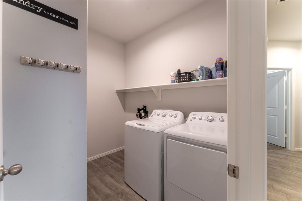 9712 Cherryville Road Fort Worth, TX 76108 - Photo 7 of 27 a utility room with dryer and washer