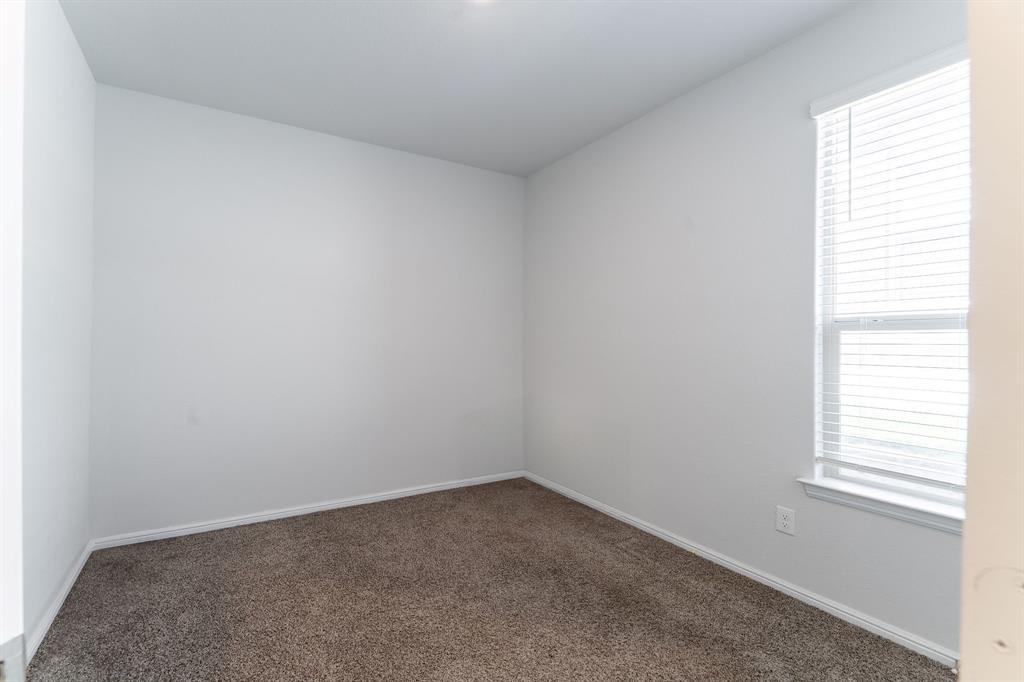 9712 Cherryville Road Fort Worth, TX 76108 - Photo 9 of 27 an empty room with a window