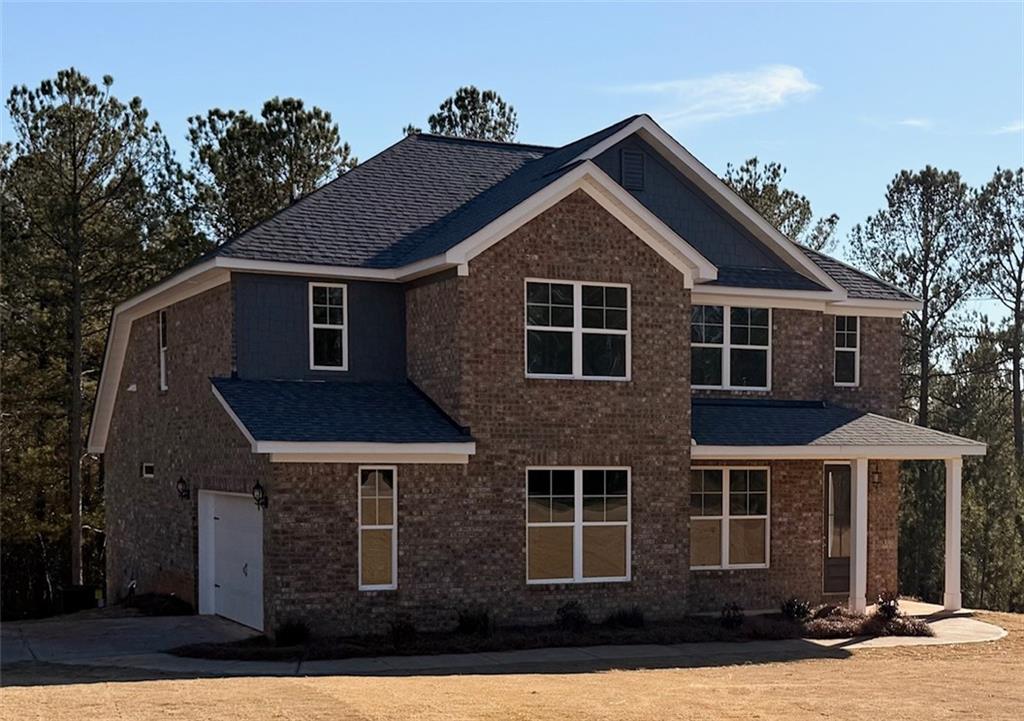 2910 Red Fox Drive, Unit 48 Haddock, GA 31033 - Photo 1 of 8 a front view of a house with yard