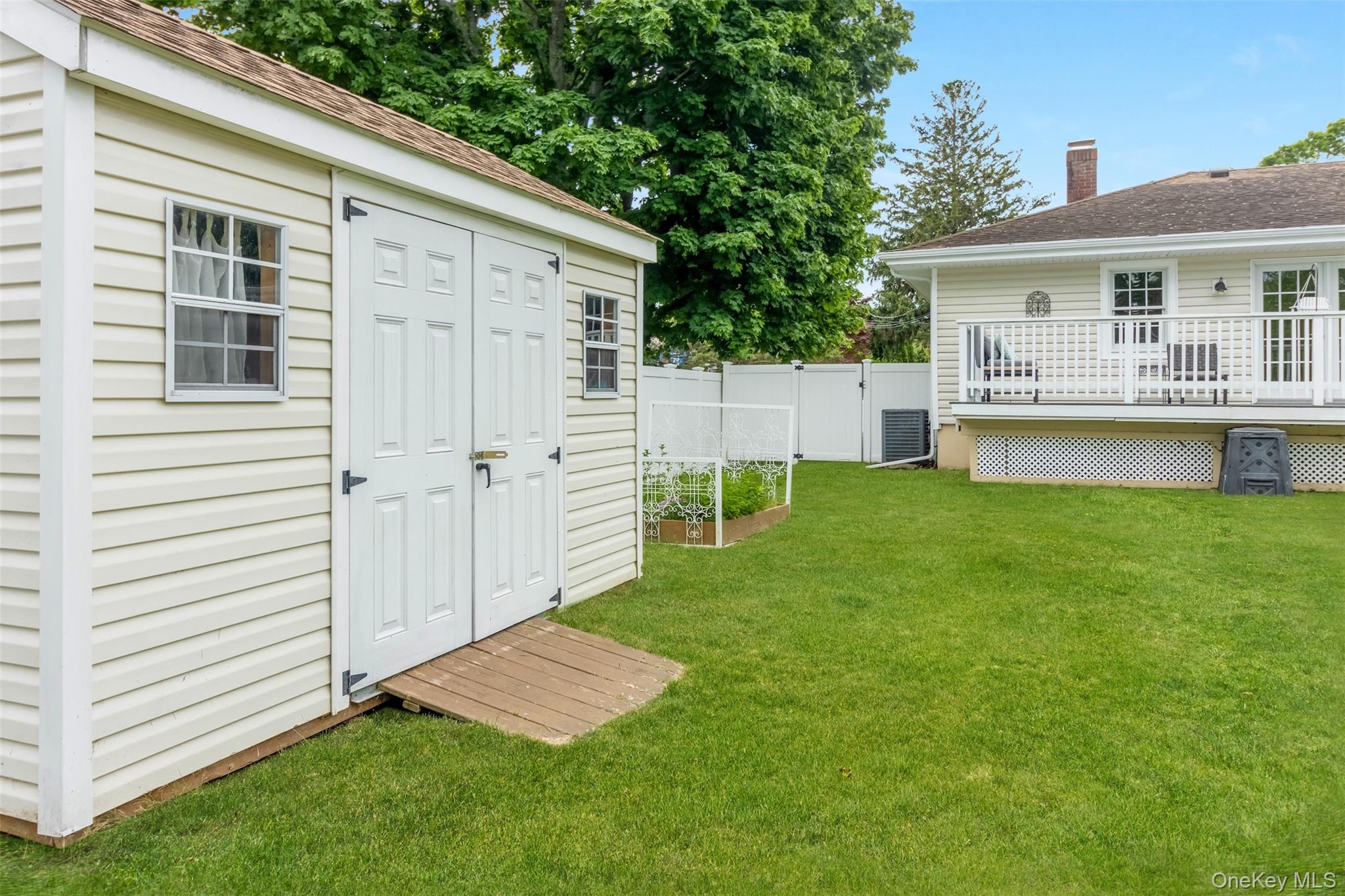 315 Wicks Road New Suffolk, NY 11956 - Photo 21 of 28 a view of a house with a backyard