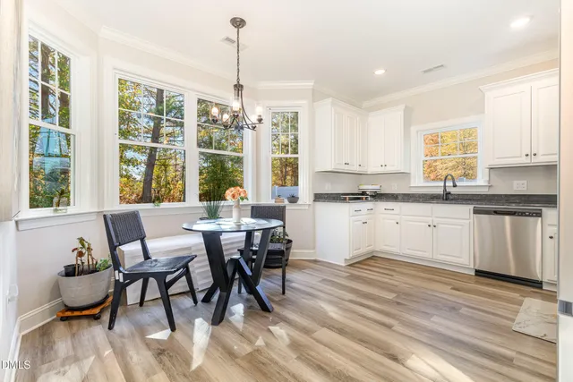 a living room with a fireplace and a flat screen tv