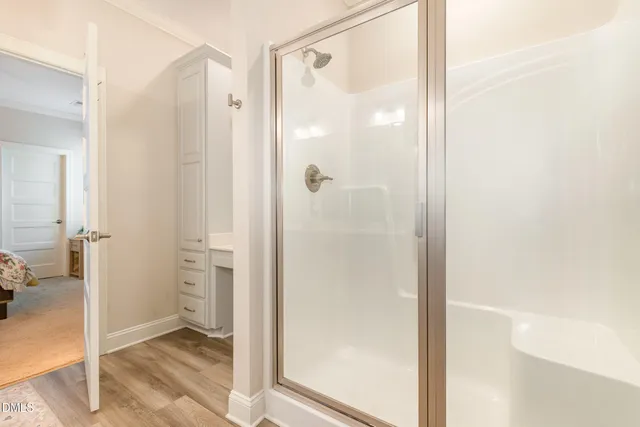 a bathroom with a double vanity sink and mirror