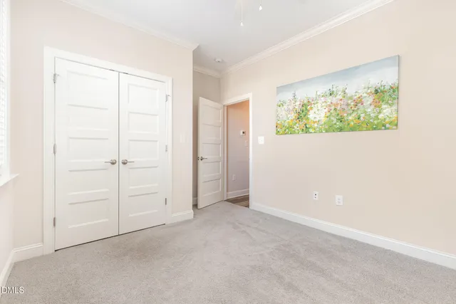 a bedroom with bed and a window