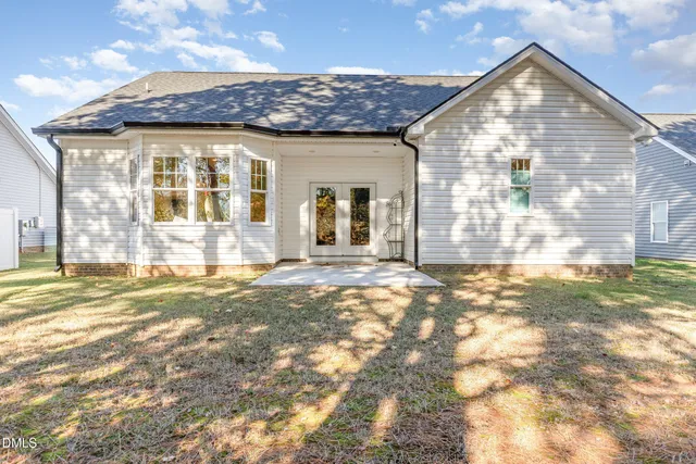 a view of a house with a snow in the background