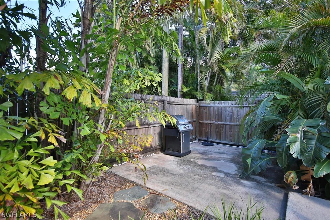 2979 Holly Road Fort Myers, FL 33901 - Photo 24 of 24 a wooden fence with some plants
