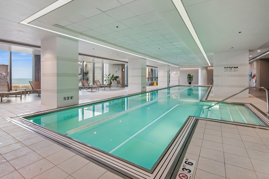 60 East Monroe Street, Unit 4006 Chicago, IL 60603 - Photo 24 of 26 a room with pool table and chairs