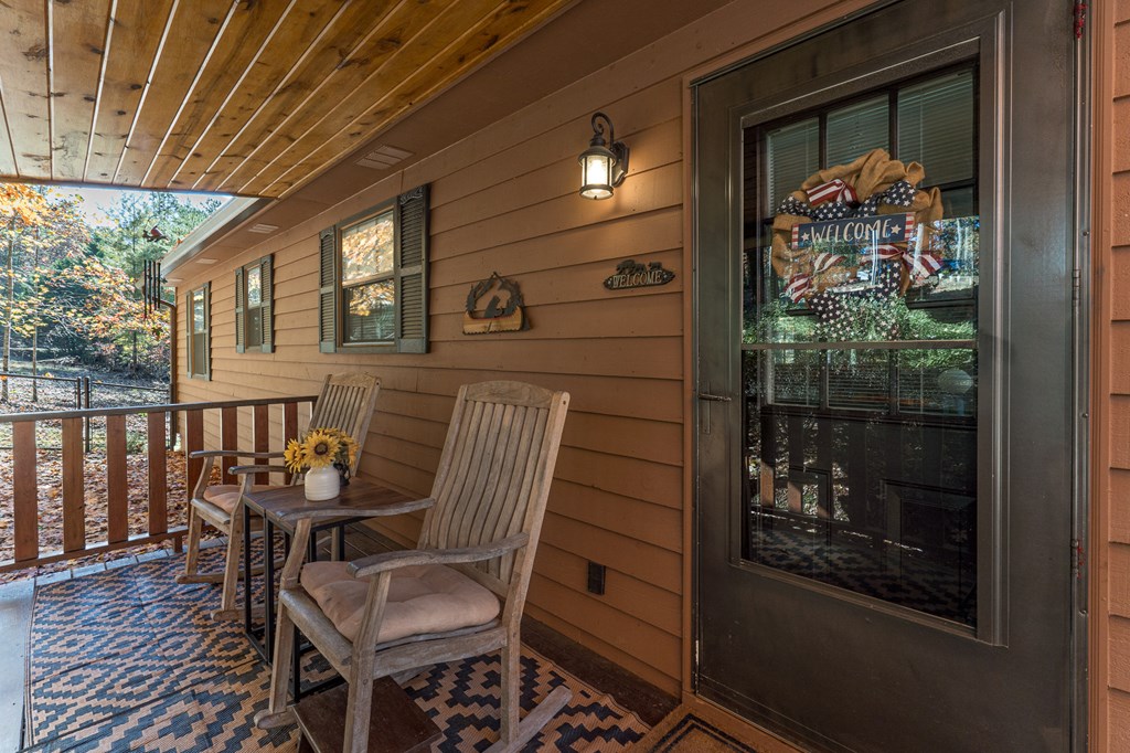 9 Settlers Crossing Way Murphy, NC 28906 - Photo 2 of 37 a view of a porch with furniture and front door