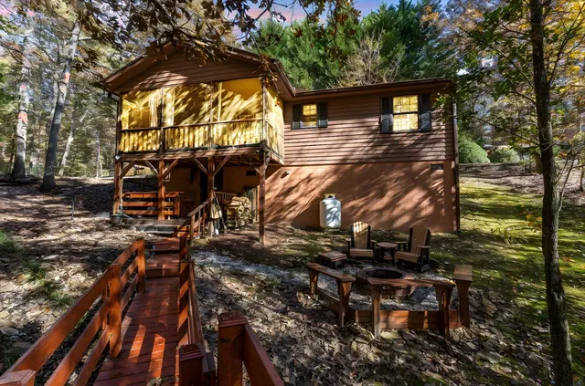 a view of a house with a tree