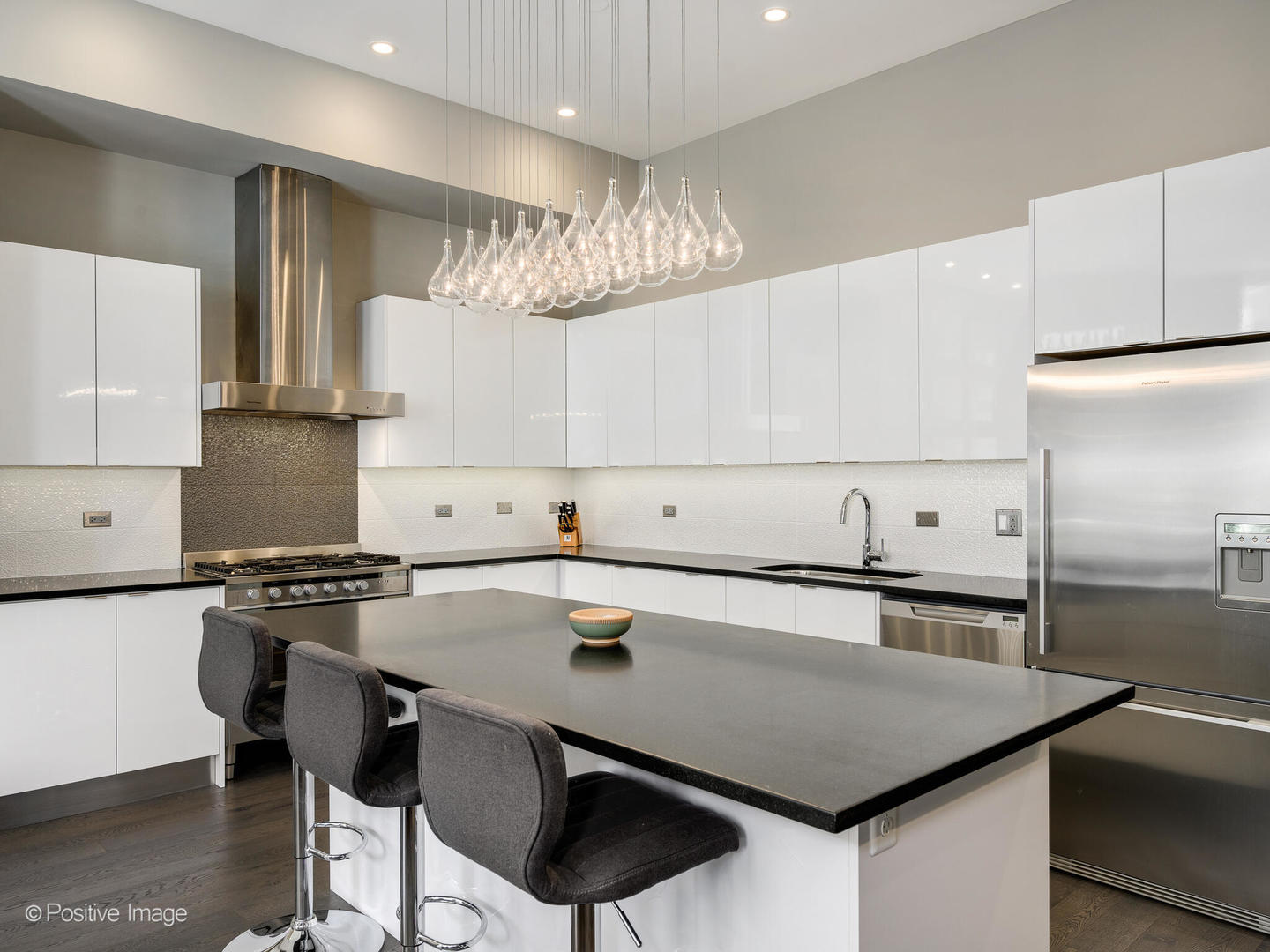 23 North Aberdeen Street, Unit 2N Chicago, IL 60607 - Photo 12 of 29 a kitchen with a table chairs stove and cabinets