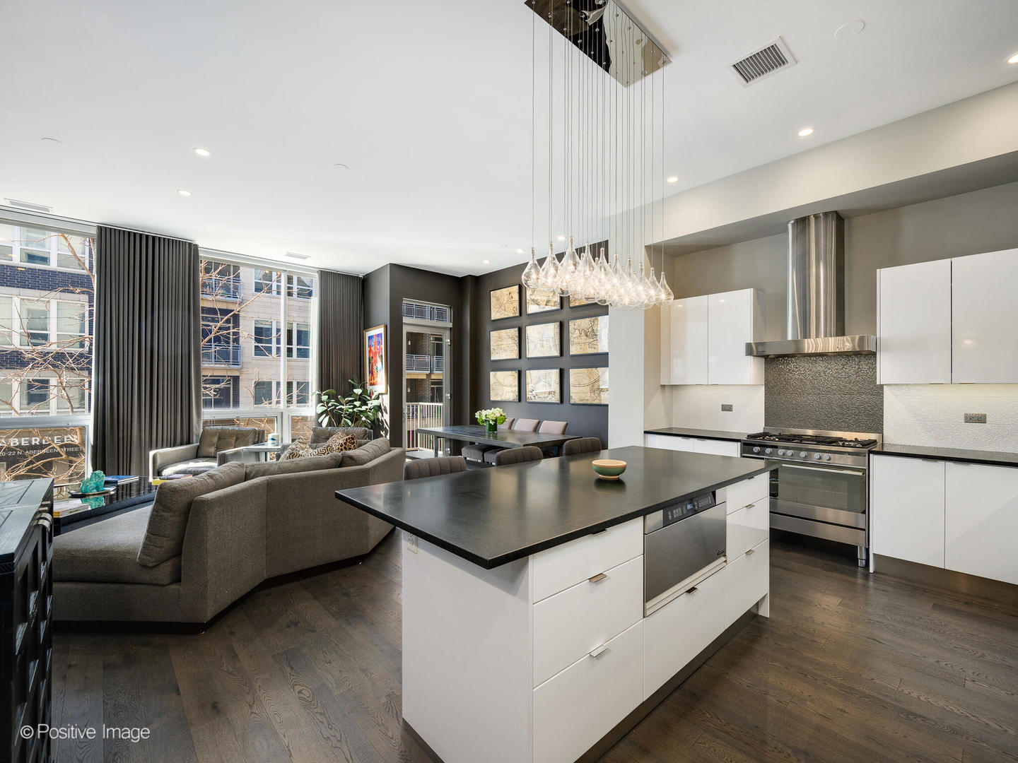23 North Aberdeen Street, Unit 2N Chicago, IL 60607 - Photo 14 of 29 a kitchen with granite countertop a sink and white cabinets