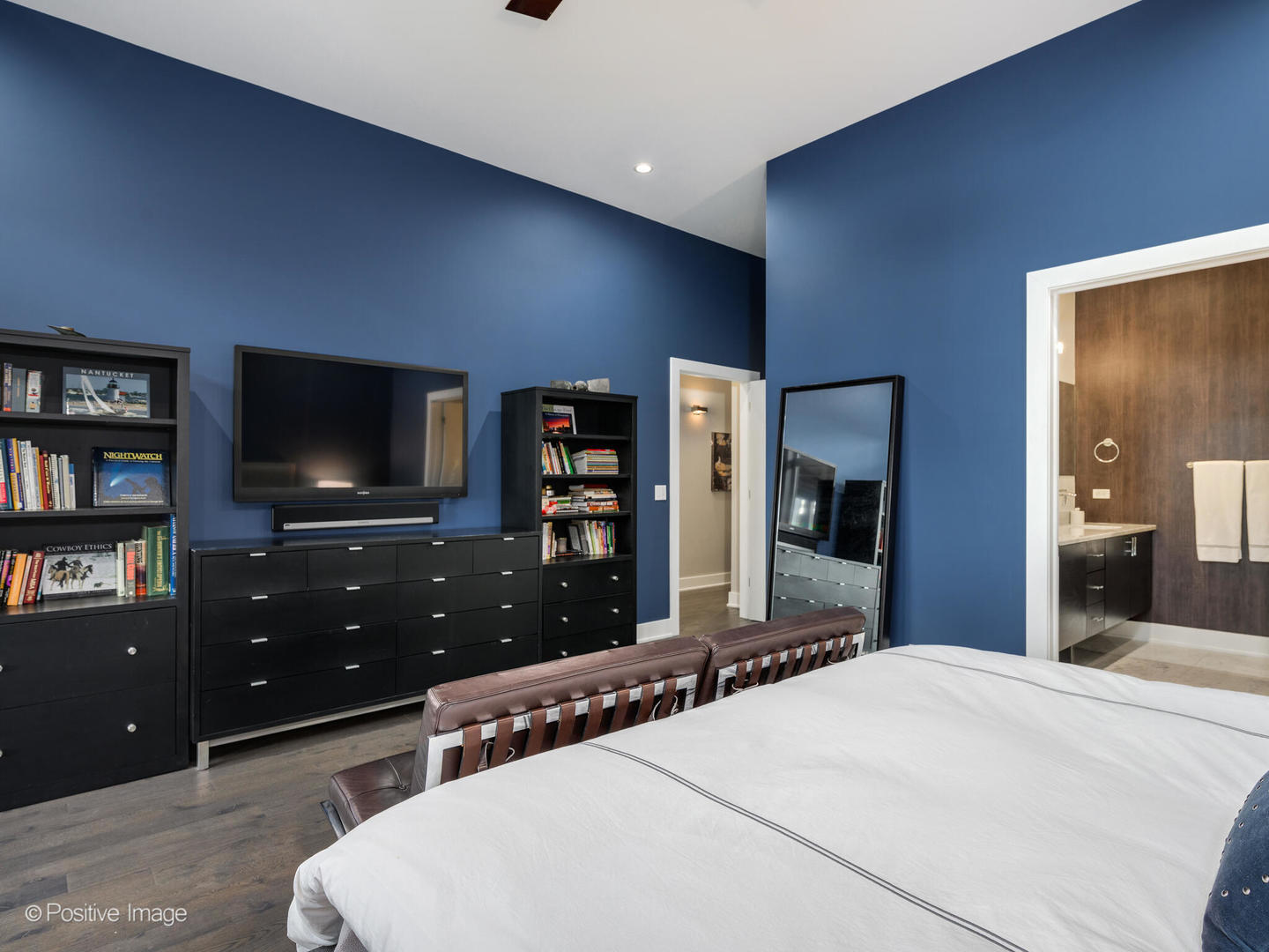 23 North Aberdeen Street, Unit 2N Chicago, IL 60607 - Photo 17 of 29 a bedroom with a bed and a flat screen tv