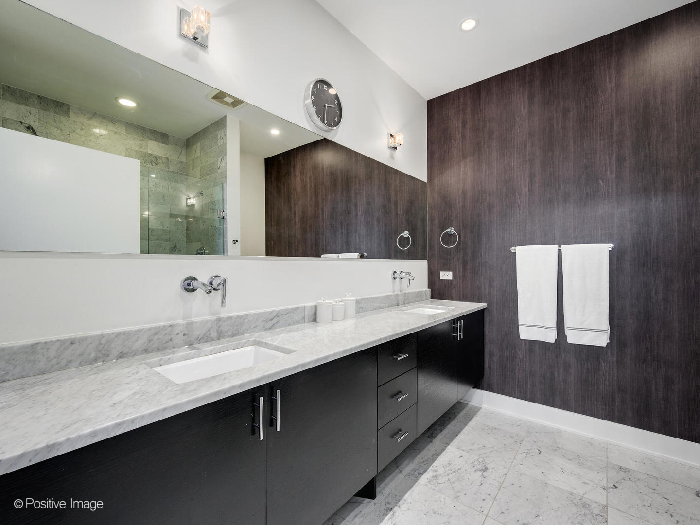 23 North Aberdeen Street, Unit 2N Chicago, IL 60607 - Photo 18 of 29 a bathroom with a double vanity sink and a mirror