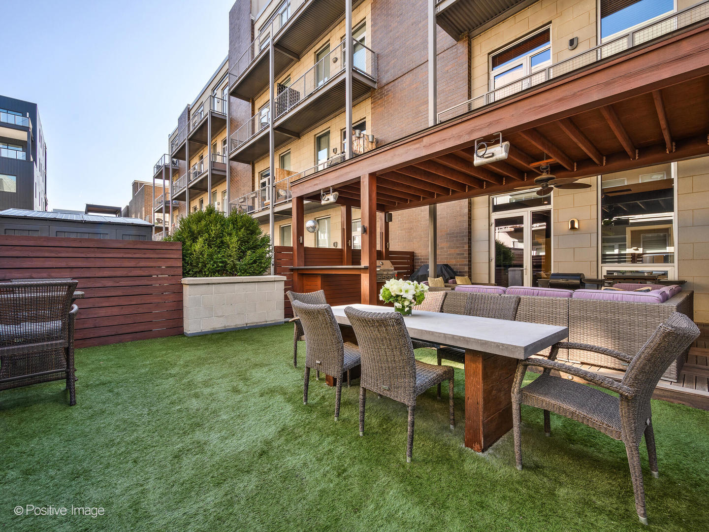 23 North Aberdeen Street, Unit 2N Chicago, IL 60607 - Photo 23 of 29 a view of a backyard with a table and chairs