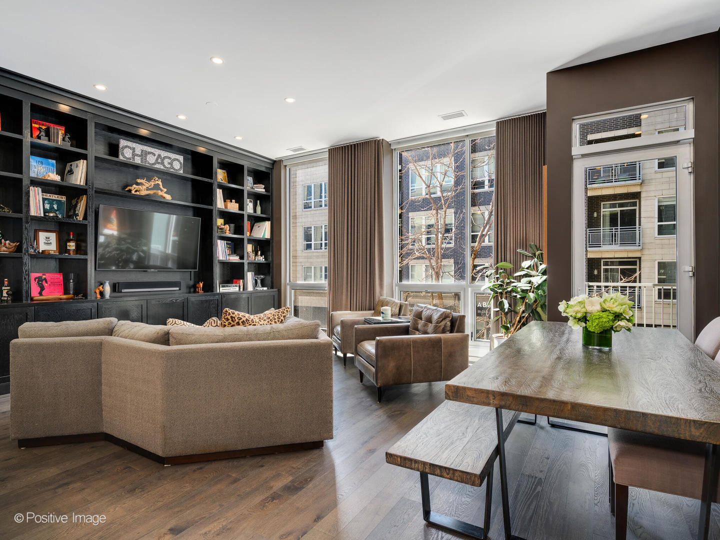 23 North Aberdeen Street, Unit 2N Chicago, IL 60607 - Photo 3 of 29 a living room with furniture and a flat screen tv