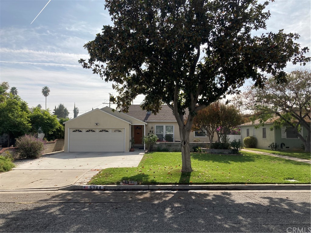 5394 Sierra Street Riverside, CA 92504 - Photo 1 of 1 a front view of a house with a yard