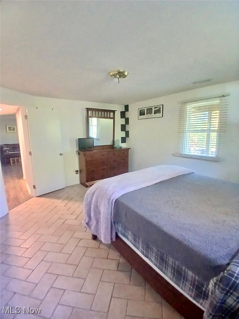 1685 Fattler Ridge Road Philo, OH 43771 - Photo 7 of 24 Bedroom with brick patterned flooring