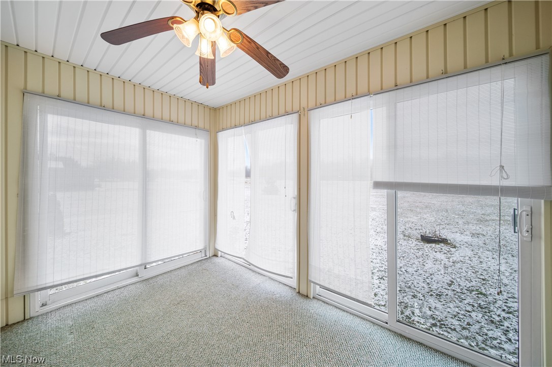 6037 Gerald Road Ashtabula, OH 44004 - Photo 21 of 34 Unfurnished sunroom featuring ceiling fan