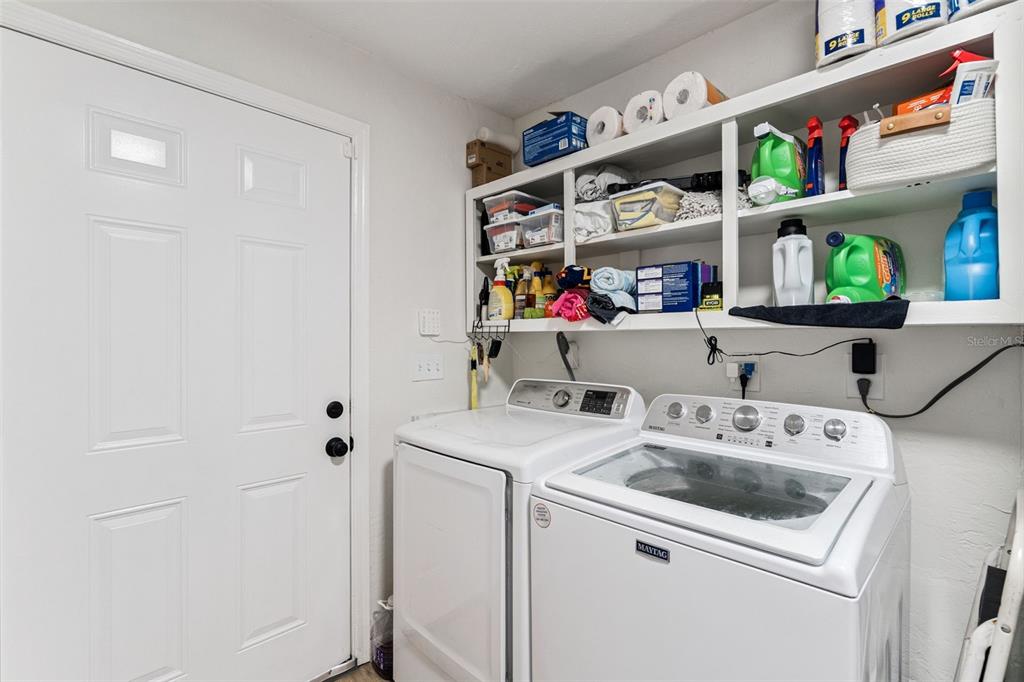 1051 Eva Street Deltona, FL 32725 - Photo 35 of 50 a utility room with dryer and washer