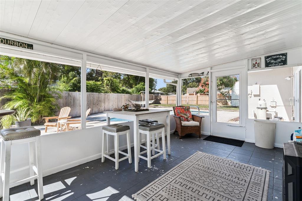 1051 Eva Street Deltona, FL 32725 - Photo 39 of 50 a kitchen with a table chairs stove and wooden floor