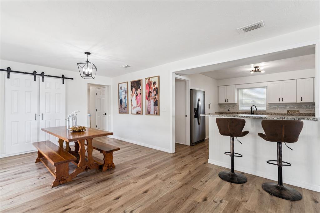 1051 Eva Street Deltona, FL 32725 - Photo 10 of 50 a living room with furniture and wooden floor