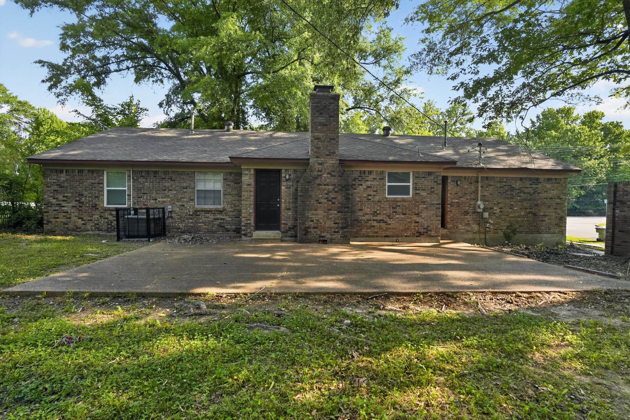 2015 East Holmes Road Memphis, TN 38116 - Photo 10 of 34 a front view of a house with a yard