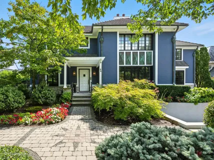 a view of a house with potted plants