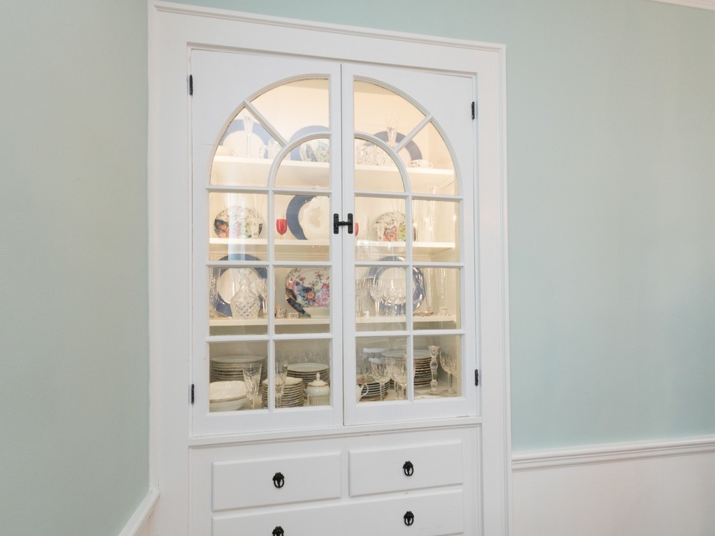 27 Churchill Road Boston, MA 02132 - Photo 11 of 30 a view of a wooden door with a glass door and a window
