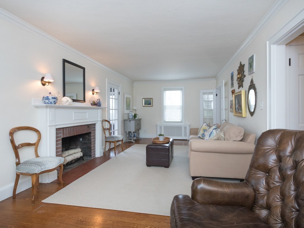27 Churchill Road Boston, MA 02132 - Photo 14 of 30 a living room with furniture fireplace and window