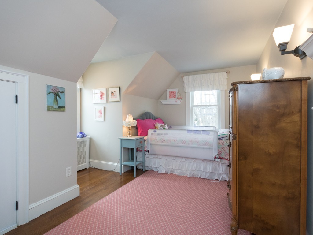 27 Churchill Road Boston, MA 02132 - Photo 21 of 30 a bedroom with a bed and a dresser