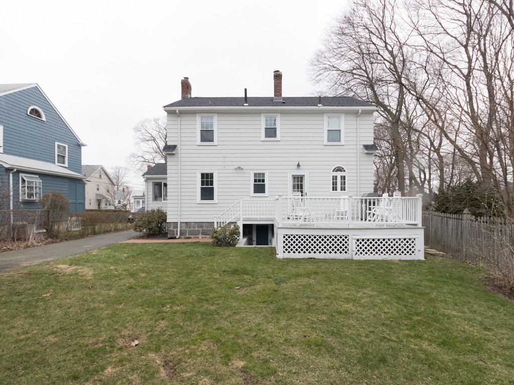 27 Churchill Road Boston, MA 02132 - Photo 27 of 30 a front view of a house with a garden