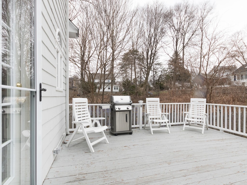 27 Churchill Road Boston, MA 02132 - Photo 29 of 30 a view of a chair and tables