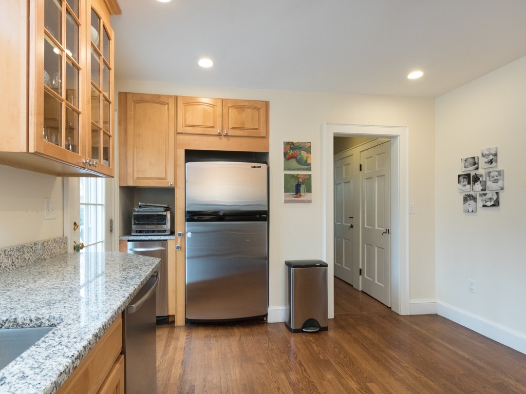 27 Churchill Road Boston, MA 02132 - Photo 7 of 30 a kitchen with granite countertop a refrigerator and a sink