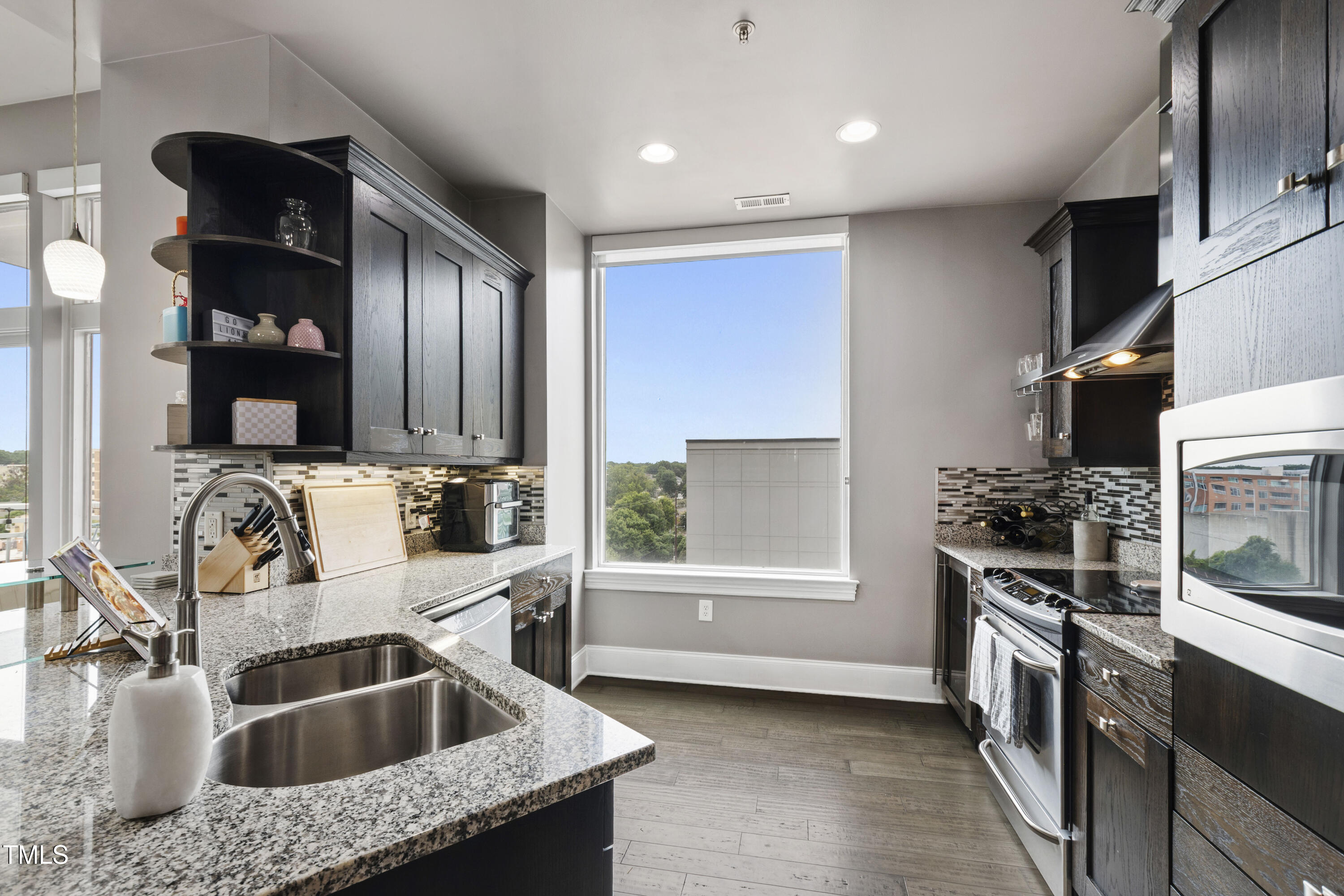 400 West North Street, Unit 610 Raleigh, NC 27603 - Photo 14 of 43 a kitchen that has a sink and a stove