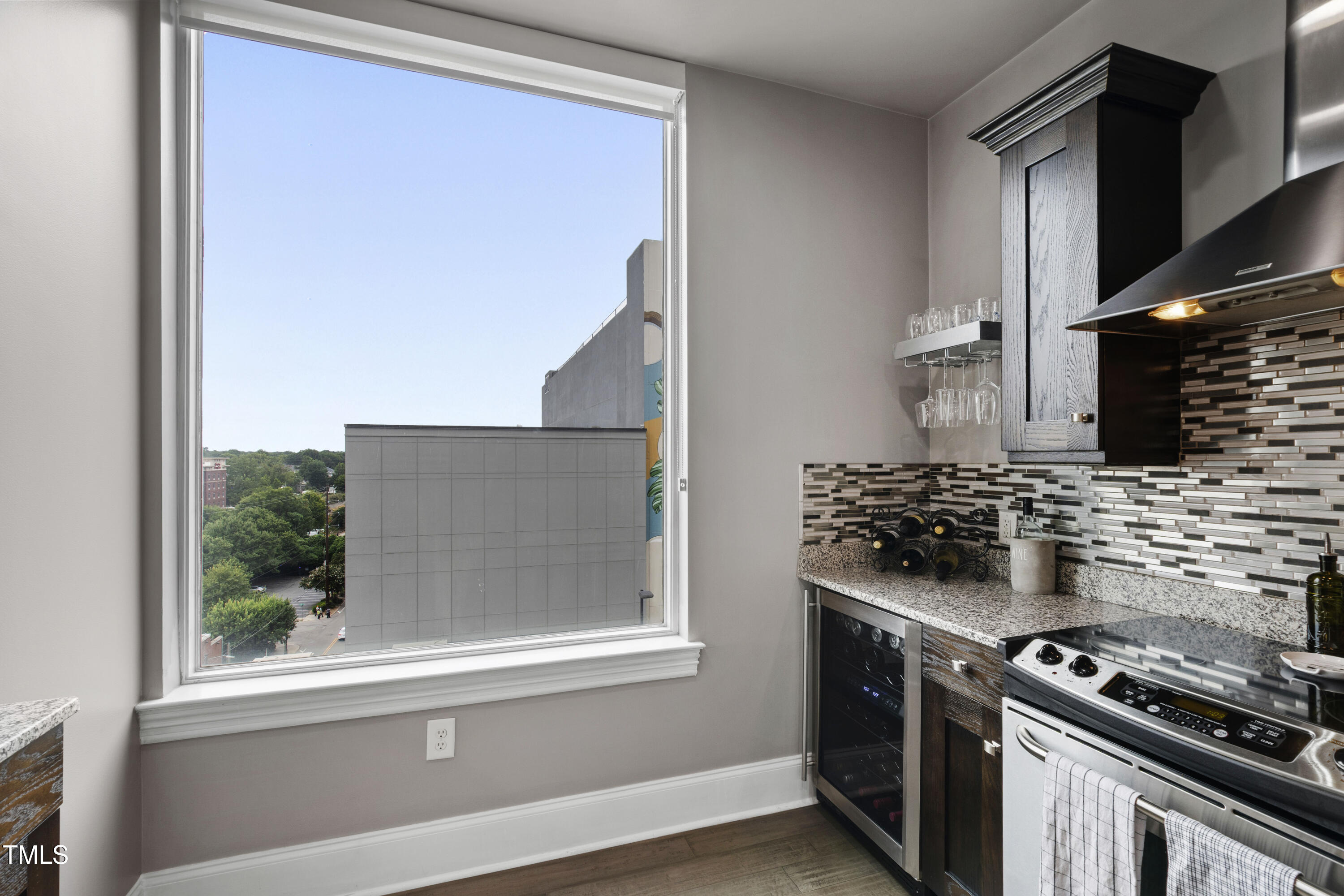 400 West North Street, Unit 610 Raleigh, NC 27603 - Photo 15 of 43 a kitchen with a stove and a microwave