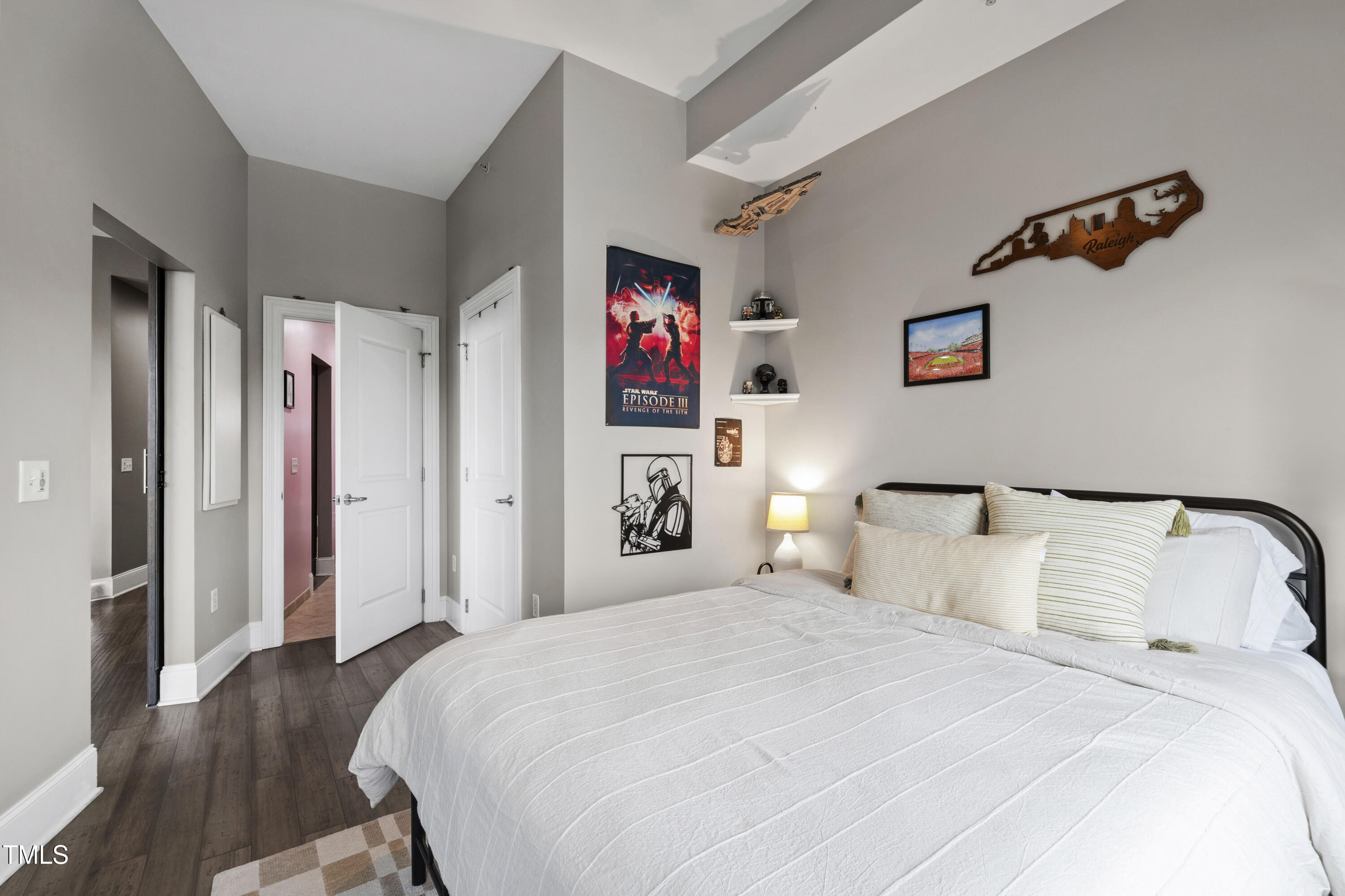 400 West North Street, Unit 610 Raleigh, NC 27603 - Photo 17 of 43 a bedroom with bed and a night stand