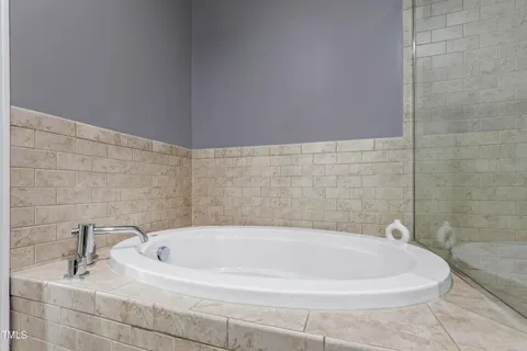 a white bath tub sitting in a bathroom