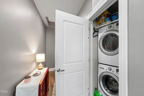 a view of a bedroom with washer and dryer