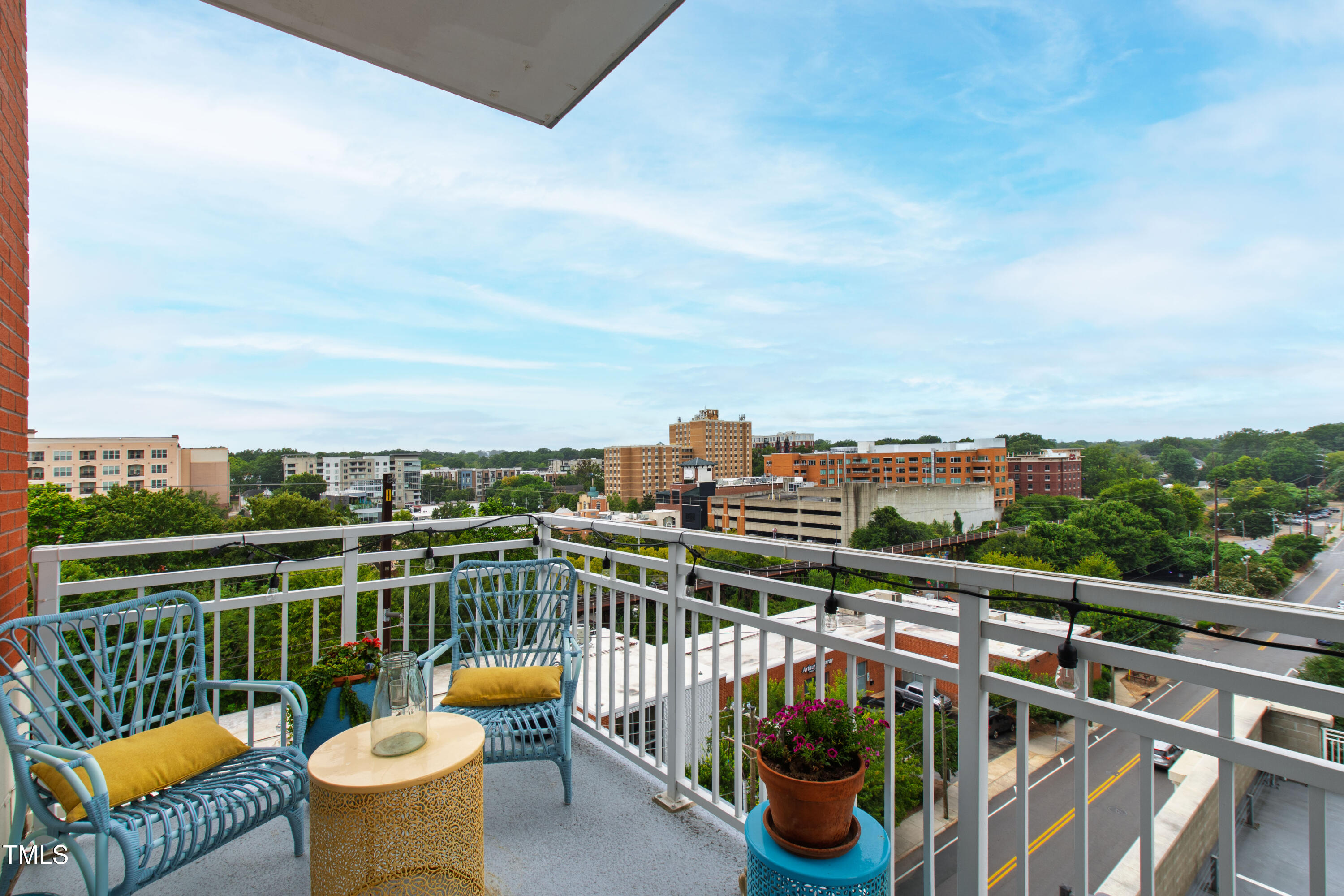 400 West North Street, Unit 610 Raleigh, NC 27603 - Photo 31 of 43 a view of a balcony with outdoor seating