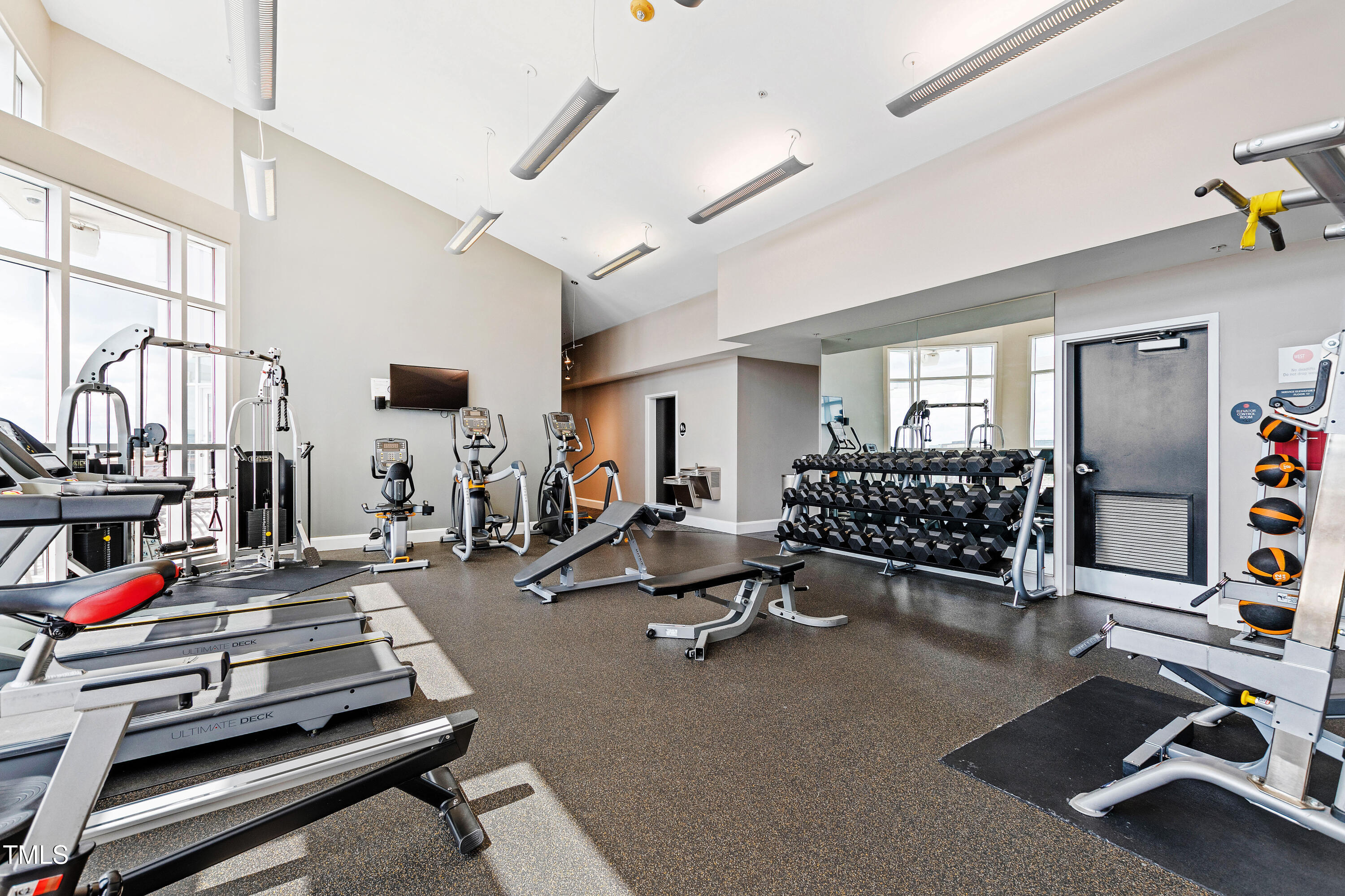 400 West North Street, Unit 610 Raleigh, NC 27603 - Photo 37 of 43 a room with gym equipment and a table