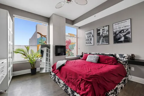 a spacious bedroom with a bed and a couch