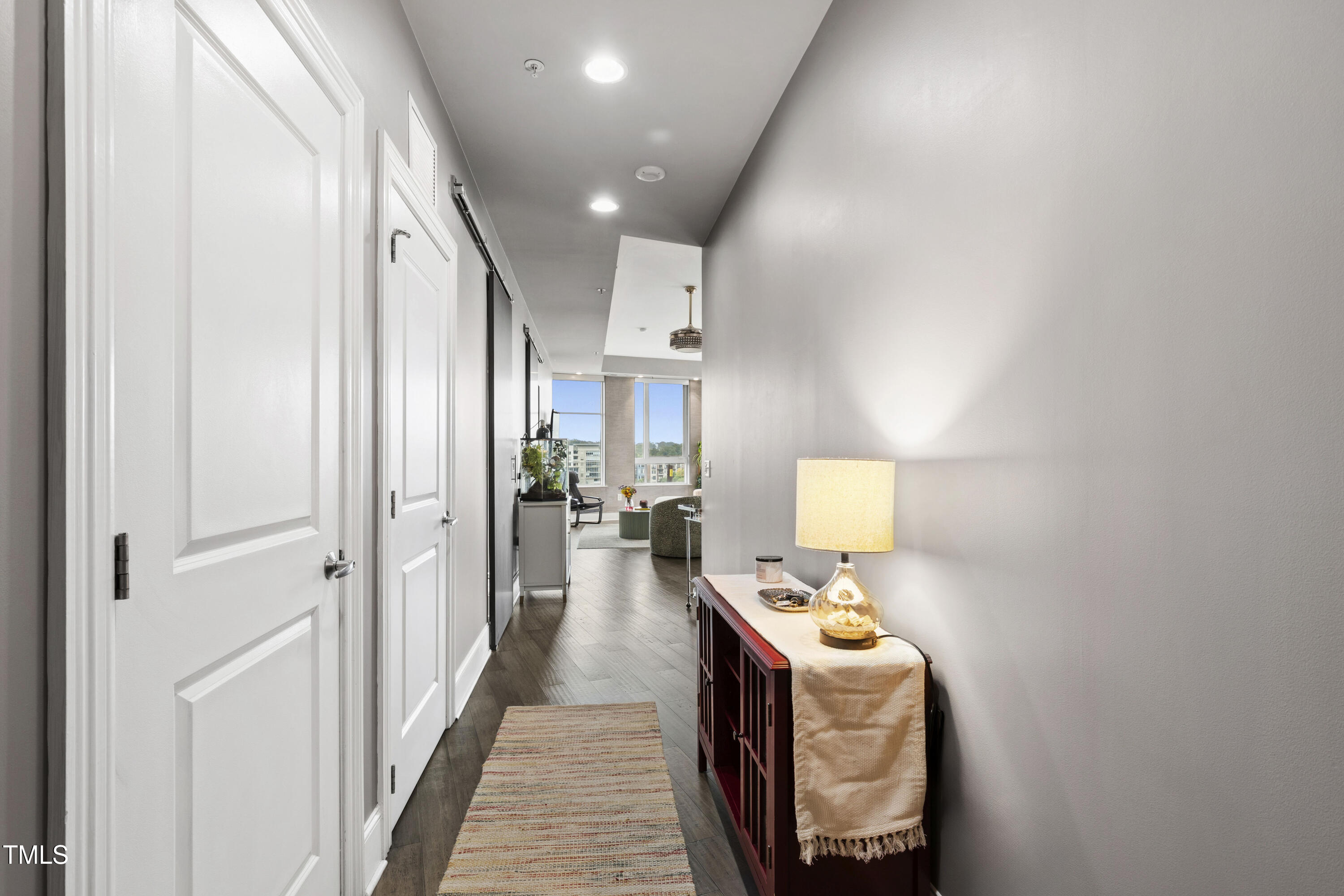 400 West North Street, Unit 610 Raleigh, NC 27603 - Photo 9 of 43 a bathroom with a sink a mirror and shower