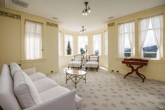 a view of a livingroom with furniture and window