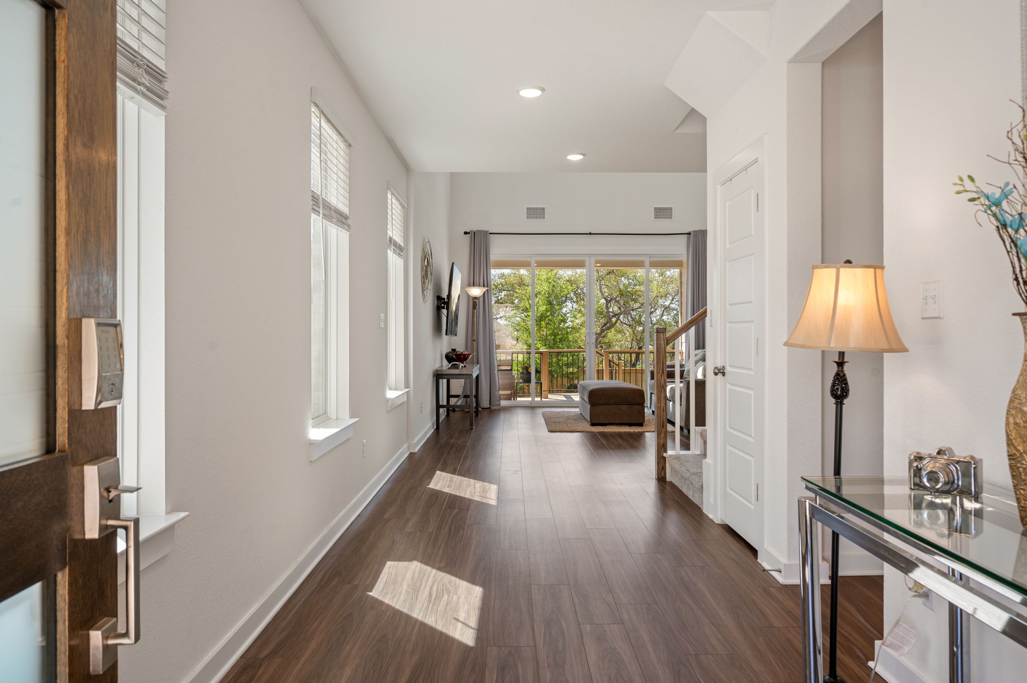 256 Comfort Maple Lane Dripping Springs, TX 78620 - Photo 2 of 39 As you enter you’ll immediately be drawn to the sun-drenched interior.